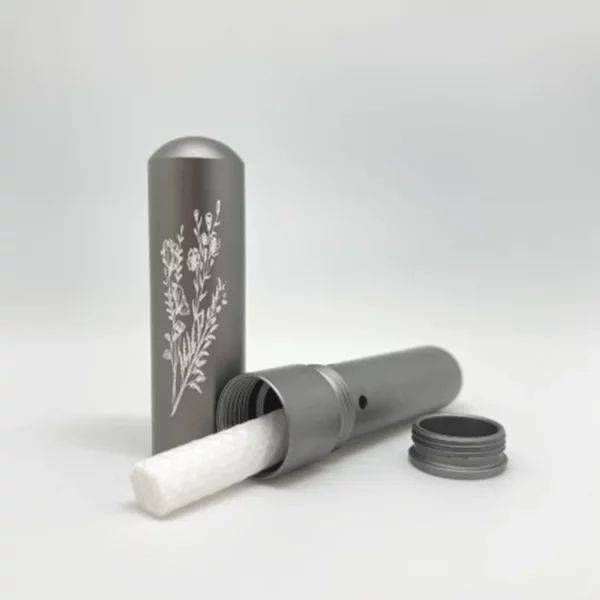 Inhaler personal diffuser for essential oils. Aluminium inhaler in cardboard box. Grey finish with floral pattern.