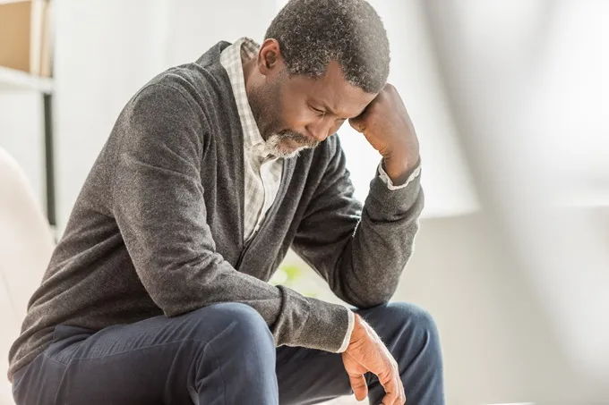 Symptoms of male menopause can include depression and fatigue.