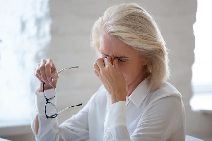 woman suffering from a headache caused by the menopause