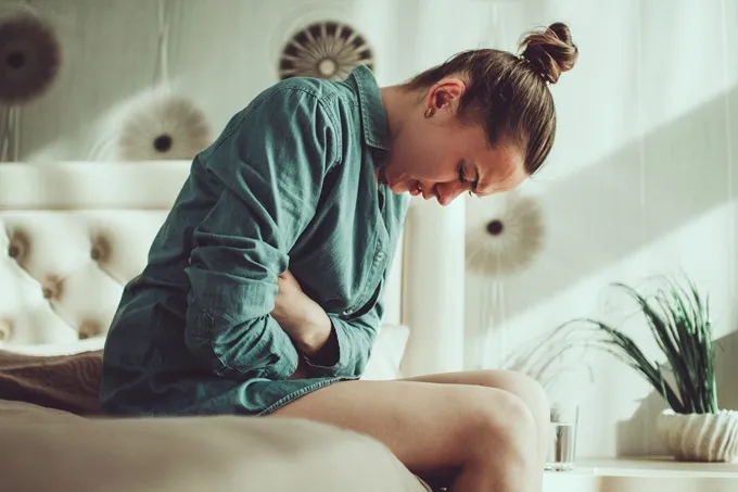Women experiencing a spasm-type pain in their stomach can often be caused by the menstrual cycle.