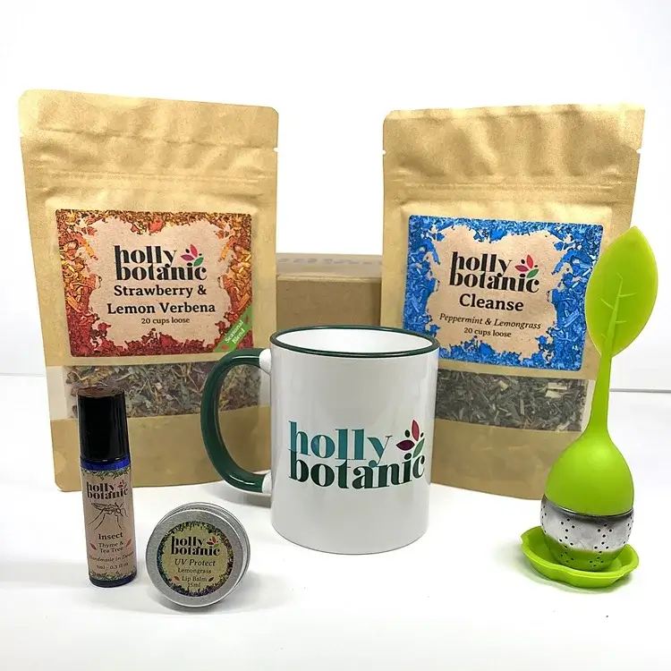 Sun Lover Gift set includes strawberry & lemon verbena tisane, cleanse tisane, UV lip balm, insect oil, mug and infuser Packaged in a magnetic-close, cardboard reusable gift box.