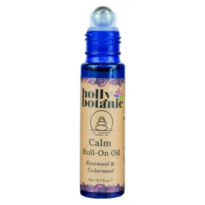 Calm roll on oil by Holly Botanic. 9ml, blue glass, recyclable bottle with metal roller and plastic lid. Lid off.