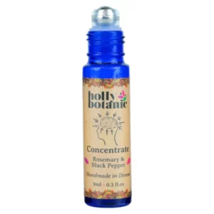 Concentrate roll on oil by Holly Botanic. 9ml, blue glass, recyclable bottle with metal roller and plastic lid. Lid off.