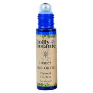 Insect roll on oil by Holly Botanic. 9ml, blue glass, recyclable bottle with metal roller and plastic lid. Lid off.