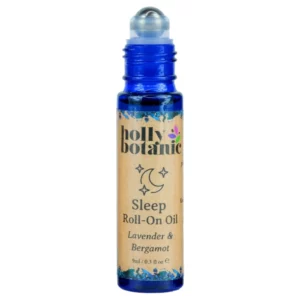 Sleep roll on oil by Holly Botanic. 9ml, blue glass, recyclable bottle with metal roller and plastic lid. Lid off.