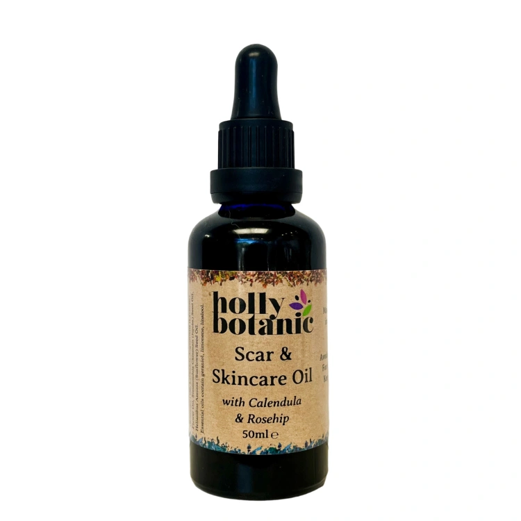 Scar oil for scars and skincare supplied in a blue glass, recyclable 50ml bottle with pipette.