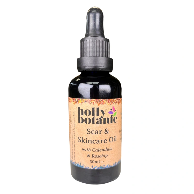 Scar and skincare oil supplied in a blue glass recyclable bottle with pipette.